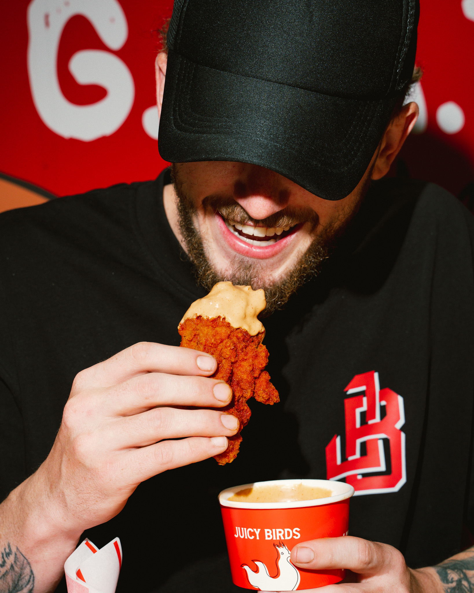 Juicy Birds tender dipped in sauce